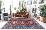 Vintage Turkish rug in a living room setting, pile rug, Turkish rug, vintage rug, portland, rug shop, bright colors, wild shaman, soft rug, bold color, Portland, Oregon, rug store, rug shop, local shop, antique rug