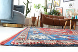 Vintage Turkish rug in a living room setting, pile rug, Turkish rug, vintage rug, portland, rug shop, bright colors, wild shaman, soft rug, bold color, Portland, Oregon, rug store, rug shop, local shop, antique rug
