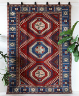 Vintage Turkish rug in a living room setting, pile rug, Turkish rug, vintage rug, portland, rug shop, bright colors, wild shaman, soft rug, bold color, Portland, Oregon, rug store, rug shop, local shop, antique rug