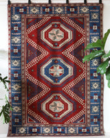 Vintage Turkish rug in a living room setting, pile rug, Turkish rug, vintage rug, portland, rug shop, bright colors, wild shaman, soft rug, bold color, Portland, Oregon, rug store, rug shop, local shop, antique rug