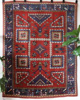 Vintage Turkish rug in a living room setting, pile rug, Turkish rug, vintage rug, portland, rug shop, bright colors, wild shaman, soft rug, bold color, Portland, Oregon, rug store, rug shop, local shop, antique rug