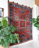 Vintage Turkish rug in a living room setting, pile rug, Turkish rug, vintage rug, portland, rug shop, bright colors, wild shaman, soft rug, bold color, Portland, Oregon, rug store, rug shop, local shop, antique rug