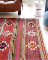 Vintage kilim rug in room decor setting, old rug, antique rug, pastel colors, faded colors, Turkish rug, vintage rug, soft rug, Portland, Oregon, rug store, rug shop, local shop, bold colors, bright colors, faded colors