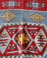 Vintage kilim rug in living room setting, bright colors, wild shaman, soft rug, bold color, Portland, Oregon, rug store, rug shop, local shop, vintage rug, modern kilim, warm colors, antique kilim rug