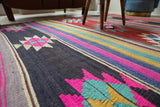 Vintage kilim rug in living room setting, bright colors, wild shaman, soft rug, bold color, Portland, Oregon, rug store, rug shop, local shop, vintage rug, modern kilim, warm colors