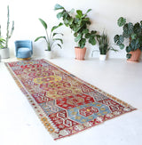 Vintage kilim rug in living room setting, bright colors, wild shaman, soft rug, bold color, Portland, Oregon, rug store, rug shop, local shop, vintage rug, modern kilim, warm colors, antique kilim rug