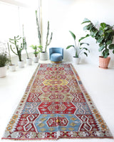 Vintage kilim rug in living room setting, bright colors, wild shaman, soft rug, bold color, Portland, Oregon, rug store, rug shop, local shop, vintage rug, modern kilim, warm colors, antique kilim rug