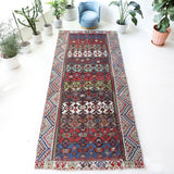 Vintage kilim rug in living room setting, bright colors, wild shaman, soft rug, bold color, Portland, Oregon, rug store, rug shop, local shop, vintage rug, modern kilim, warm colors, antique kilim rug