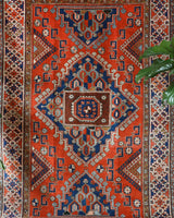 Vintage Turkish rug in a living room setting, pile rug, Turkish rug, vintage rug, portland, rug shop, bright colors, wild shaman, soft rug, bold color, Portland, Oregon, rug store, rug shop, local shop, antique rug
