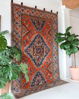 Vintage Turkish rug in a living room setting, pile rug, Turkish rug, vintage rug, portland, rug shop, bright colors, wild shaman, soft rug, bold color, Portland, Oregon, rug store, rug shop, local shop, antique rug