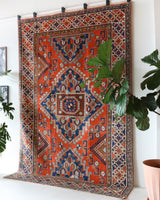Vintage Turkish rug in a living room setting, pile rug, Turkish rug, vintage rug, portland, rug shop, bright colors, wild shaman, soft rug, bold color, Portland, Oregon, rug store, rug shop, local shop, antique rug