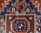 Vintage Turkish rug in a living room setting, pile rug, Turkish rug, vintage rug, portland, rug shop, bright colors, wild shaman, soft rug, bold color, Portland, Oregon, rug store, rug shop, local shop, antique rug