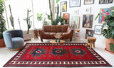 Vintage Turkish rug in a living room setting, pile rug, Turkish rug, vintage rug, portland, rug shop, bright colors, wild shaman, soft rug, bold color, Portland, Oregon, rug store, rug shop, local shop, antique rug