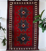 Vintage Turkish rug in a living room setting, pile rug, Turkish rug, vintage rug, portland, rug shop, bright colors, wild shaman, soft rug, bold color, Portland, Oregon, rug store, rug shop, local shop, antique rug