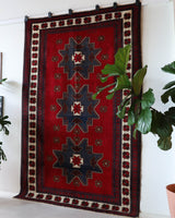 Vintage Turkish rug in a living room setting, pile rug, Turkish rug, vintage rug, portland, rug shop, bright colors, wild shaman, soft rug, bold color, Portland, Oregon, rug store, rug shop, local shop, antique rug