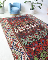 Vintage kilim rug in living room setting, bright colors, wild shaman, soft rug, bold color, Portland, Oregon, rug store, rug shop, local shop, vintage rug, modern kilim, warm colors, antique kilim rug