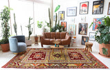 Vintage Turkish rug in a living room setting, pile rug, Turkish rug, vintage rug, portland, rug shop, bright colors, wild shaman, soft rug, bold color, Portland, Oregon, rug store, rug shop, local shop, antique rug
