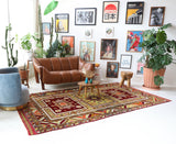 Vintage Turkish rug in a living room setting, pile rug, Turkish rug, vintage rug, portland, rug shop, bright colors, wild shaman, soft rug, bold color, Portland, Oregon, rug store, rug shop, local shop, antique rug