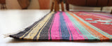 Vintage kilim rug in living room setting, bright colors, wild shaman, soft rug, bold color, Portland, Oregon, rug store, rug shop, local shop, vintage rug, modern kilim, warm colors