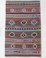 Vintage kilim rug in room decor setting, old rug, antique rug, pastel colors, faded colors, Turkish rug, vintage rug, soft rug, Portland, Oregon, rug store, rug shop, local shop, bold colors, bright colors, faded colors