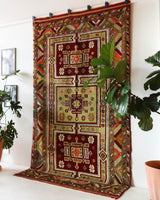 Vintage Turkish rug in a living room setting, pile rug, Turkish rug, vintage rug, portland, rug shop, bright colors, wild shaman, soft rug, bold color, Portland, Oregon, rug store, rug shop, local shop, antique rug