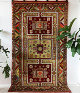 Vintage Turkish rug in a living room setting, pile rug, Turkish rug, vintage rug, portland, rug shop, bright colors, wild shaman, soft rug, bold color, Portland, Oregon, rug store, rug shop, local shop, antique rug