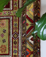 Vintage Turkish rug in a living room setting, pile rug, Turkish rug, vintage rug, portland, rug shop, bright colors, wild shaman, soft rug, bold color, Portland, Oregon, rug store, rug shop, local shop, antique rug