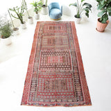 Vintage kilim rug in living room setting, old rug, antique rug, pastel colors, faded colors, Turkish rug, vintage rug, soft rug, Portland, Oregon, rug store, rug shop, local shop, earthy tones, earthy colors, warm colors