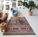 Vintage kilim rug in room decor setting, old rug, antique rug, pastel colors, faded colors, Turkish rug, vintage rug, soft rug, Portland, Oregon, rug store, rug shop, local shop, bold colors, bright colors, faded colors