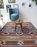 Vintage kilim rug in room decor setting, old rug, antique rug, pastel colors, faded colors, Turkish rug, vintage rug, soft rug, Portland, Oregon, rug store, rug shop, local shop, bold colors, bright colors, faded colors