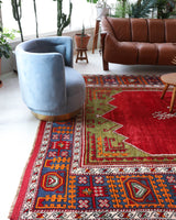 Vintage Turkish rug in a living room setting, pile rug, Turkish rug, vintage rug, portland, rug shop, bright colors, wild shaman, soft rug, bold color, Portland, Oregon, rug store, rug shop, local shop, antique rug