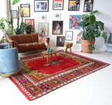 Vintage Turkish rug in a living room setting, pile rug, Turkish rug, vintage rug, portland, rug shop, bright colors, wild shaman, soft rug, bold color, Portland, Oregon, rug store, rug shop, local shop, antique rug
