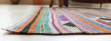 Vintage kilim rug in room decor setting, old rug, antique rug, pastel colors, faded colors, Turkish rug, vintage rug, soft rug, Portland, Oregon, rug store, rug shop, local shop, bold colors, bright colors, faded colors