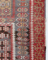 Vintage kilim rug in living room setting, old rug, antique rug, pastel colors, faded colors, Turkish rug, vintage rug, soft rug, Portland, Oregon, rug store, rug shop, local shop, earthy tones, earthy colors, warm colors