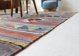 Vintage kilim rug in room decor setting, old rug, antique rug, pastel colors, faded colors, Turkish rug, vintage rug, soft rug, Portland, Oregon, rug store, rug shop, local shop, bold colors, bright colors, faded colors
