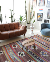 Vintage kilim rug in room decor setting, old rug, antique rug, pastel colors, faded colors, Turkish rug, vintage rug, soft rug, Portland, Oregon, rug store, rug shop, local shop, bold colors, bright colors, faded colors