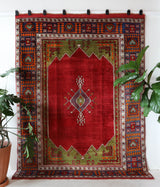 Vintage Turkish rug in a living room setting, pile rug, Turkish rug, vintage rug, portland, rug shop, bright colors, wild shaman, soft rug, bold color, Portland, Oregon, rug store, rug shop, local shop, antique rug