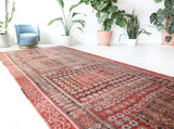Vintage kilim rug in living room setting, old rug, antique rug, pastel colors, faded colors, Turkish rug, vintage rug, soft rug, Portland, Oregon, rug store, rug shop, local shop, earthy tones, earthy colors, warm colors