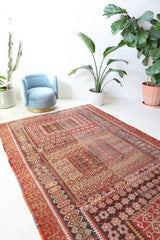 Vintage kilim rug in living room setting, old rug, antique rug, pastel colors, faded colors, Turkish rug, vintage rug, soft rug, Portland, Oregon, rug store, rug shop, local shop, earthy tones, earthy colors, warm colors