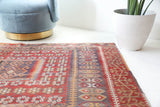 Vintage kilim rug in living room setting, old rug, antique rug, pastel colors, faded colors, Turkish rug, vintage rug, soft rug, Portland, Oregon, rug store, rug shop, local shop, earthy tones, earthy colors, warm colors