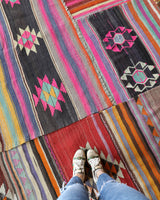 Vintage kilim rug in room decor setting, old rug, antique rug, pastel colors, faded colors, Turkish rug, vintage rug, soft rug, Portland, Oregon, rug store, rug shop, local shop, bold colors, bright colors, faded colors