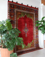 Vintage Turkish rug in a living room setting, pile rug, Turkish rug, vintage rug, portland, rug shop, bright colors, wild shaman, soft rug, bold color, Portland, Oregon, rug store, rug shop, local shop, antique rug