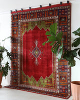 Vintage Turkish rug in a living room setting, pile rug, Turkish rug, vintage rug, portland, rug shop, bright colors, wild shaman, soft rug, bold color, Portland, Oregon, rug store, rug shop, local shop, antique rug