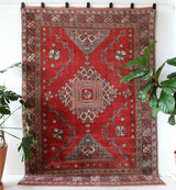 Vintage Turkish rug in living room setting, old rug, antique rug, pastel colors, faded colors, Turkish rug, vintage rug, soft rug, Portland, Oregon, rug store, rug shop, local shop
