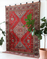 Vintage Turkish rug in living room setting, old rug, antique rug, pastel colors, faded colors, Turkish rug, vintage rug, soft rug, Portland, Oregon, rug store, rug shop, local shop