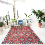 Vintage kilim rug in living room setting, old rug, antique rug, pastel colors, faded colors, Turkish rug, vintage rug, soft rug, Portland, Oregon, rug store, rug shop, local shop, earthy tones, earthy colors, warm colors