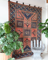 Vintage Turkish rug in living room setting, old rug, antique rug, pastel colors, faded colors, Turkish rug, vintage rug, soft rug, Portland, Oregon, rug store, rug shop, local shop