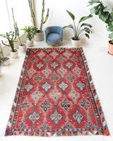 Vintage kilim rug in living room setting, old rug, antique rug, pastel colors, faded colors, Turkish rug, vintage rug, soft rug, Portland, Oregon, rug store, rug shop, local shop, earthy tones, earthy colors, warm colors