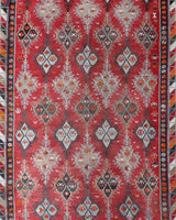 Vintage kilim rug in living room setting, old rug, antique rug, pastel colors, faded colors, Turkish rug, vintage rug, soft rug, Portland, Oregon, rug store, rug shop, local shop, earthy tones, earthy colors, warm colors