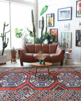 Vintage Turkish rug in living room setting, old rug, antique rug, pastel colors, faded colors, Turkish rug, vintage rug, soft rug, Portland, Oregon, rug store, rug shop, local shop